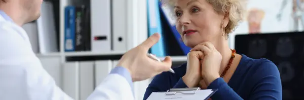 Middle‑aged woman consulting gynecologist