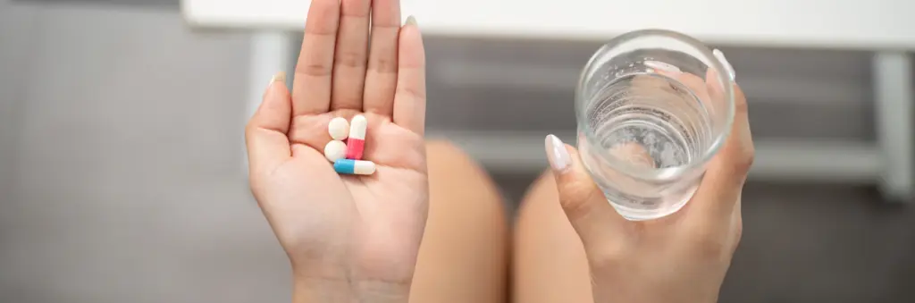 Taking medication woman